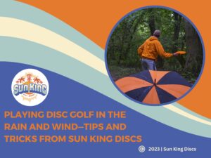 SunKing Discs logo with a man throwing an orange disc golf on a rainy and windy day in the background.